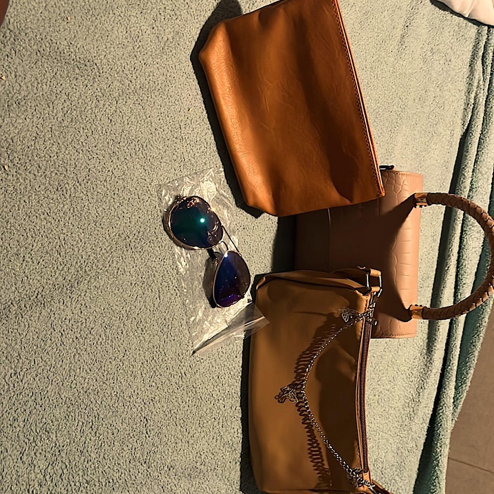 I am selling 2 purses and 1 makeup bag and some sunglasses.